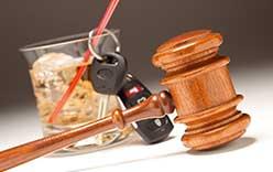 Alcoholic drink, car keys and gavel